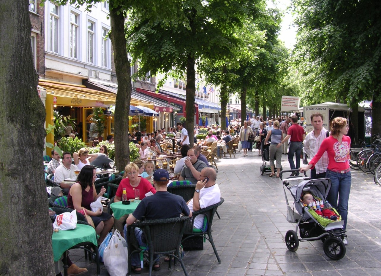 People eating outside at tables